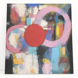 Abstract geometric stretched canvas artwork displaying vibrant colors and dynamic shapes, leaning against a minimalist wall, ideal for modern home decor.