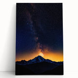 Landscape-stretched canvas artwork featuring a vibrant abstract design with bold colors, leaning against a neutral wall, ideal for modern home decor.