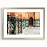 Abstract art print of a Moroccan landscape in earth tones on a silver-framed mat, ideal for dining room decor.