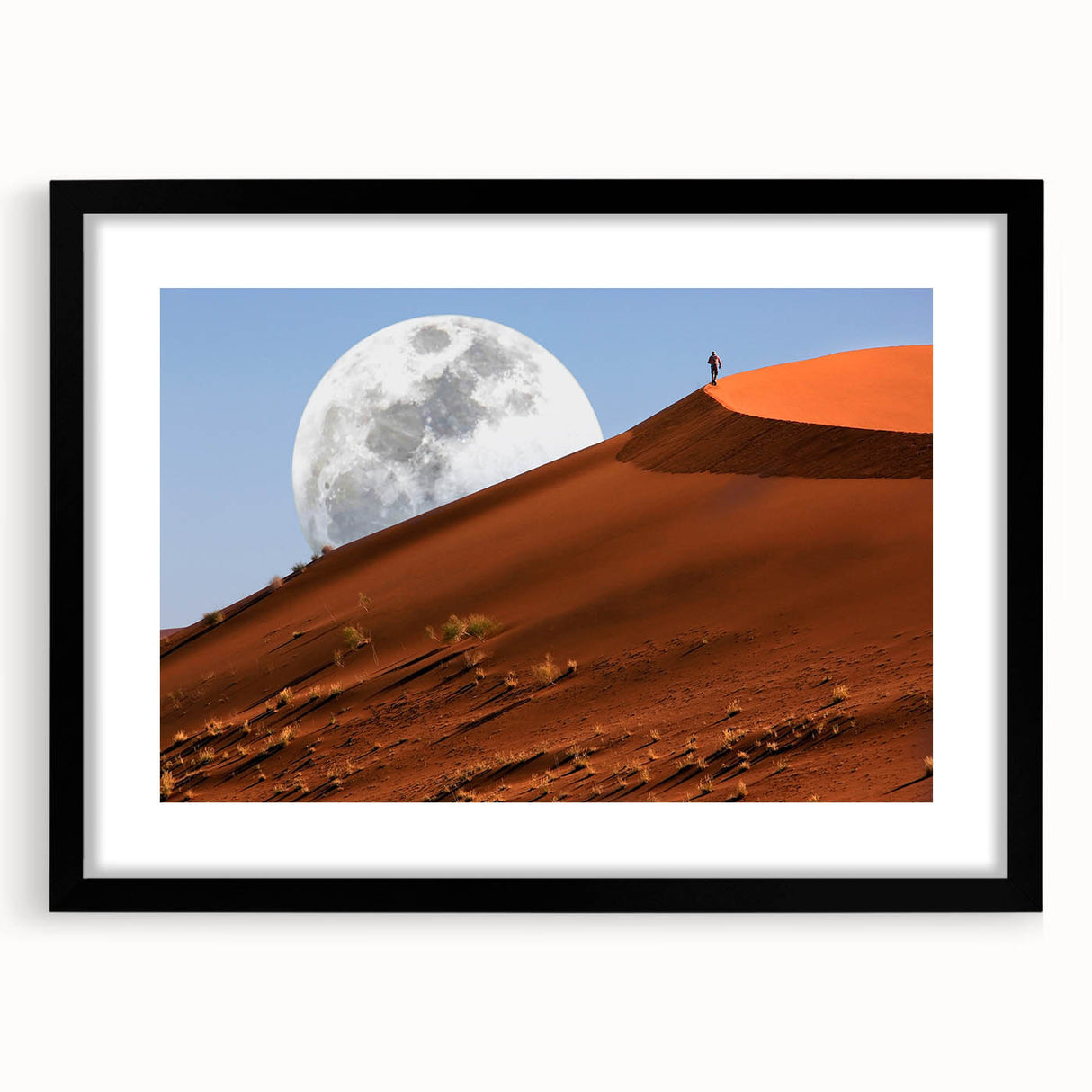 Extra large abstract art print of a colorful Namibian landscape on textured canvas, framed in black.