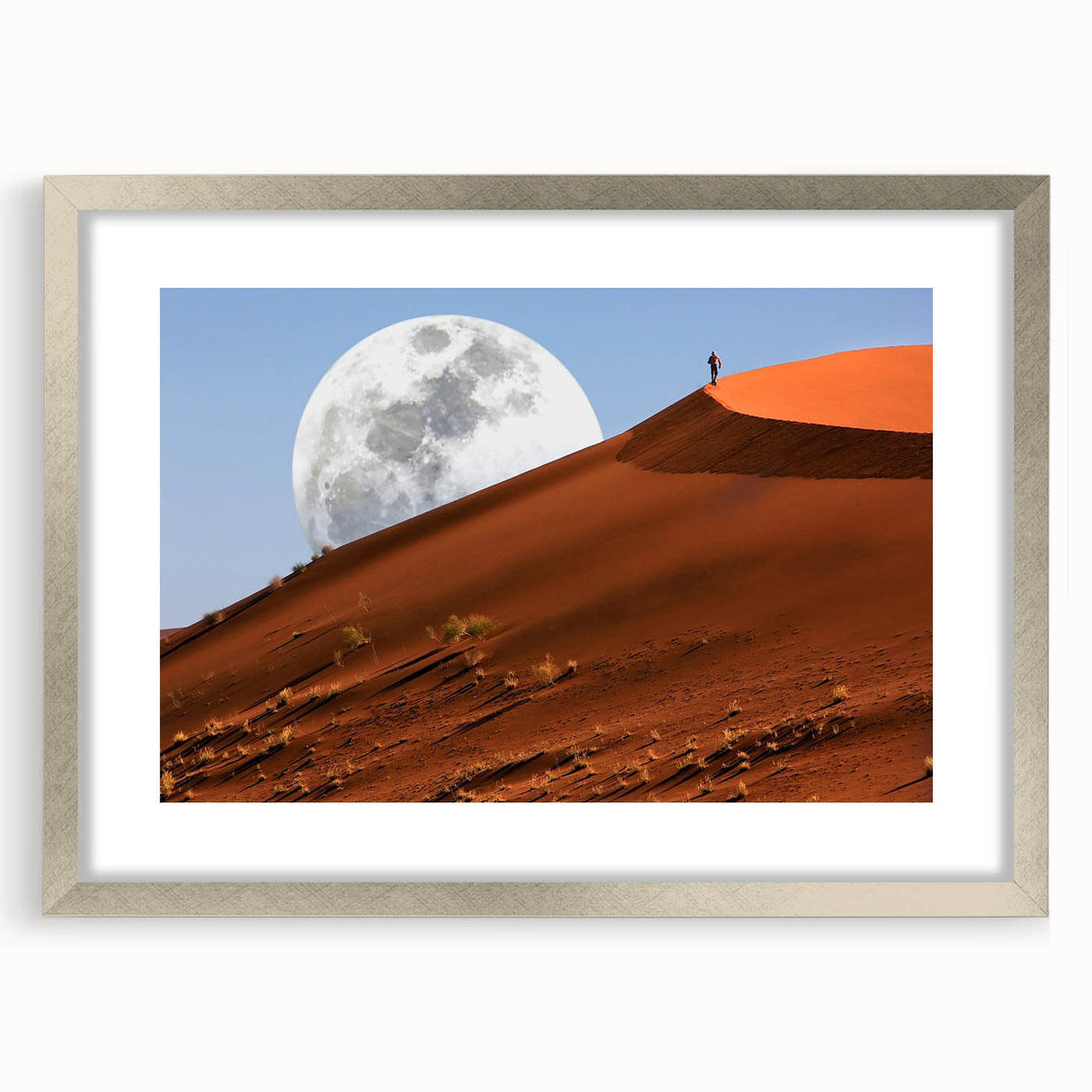 Abstract art print of a Namibian landscape in muted earth tones on a silver-framed canvas, suitable for dining room decor.