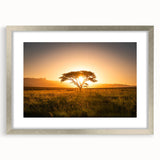 Textured abstract art print of an African landscape in muted earth tones, framed in silver, ideal for bedroom decor.