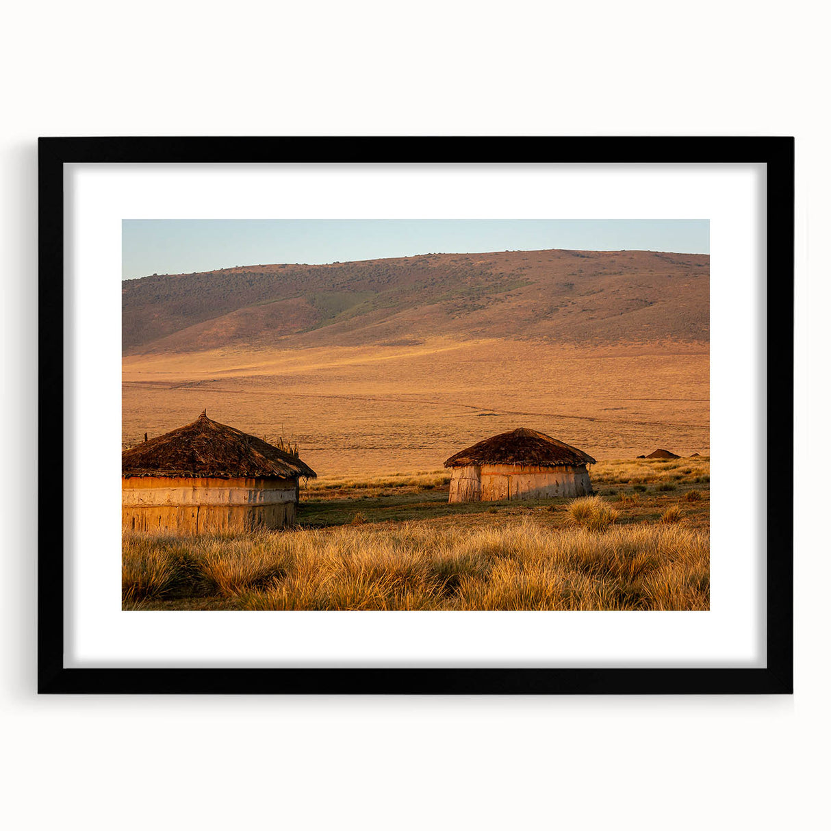 Extra large abstract art print of a colorful African landscape on a textured canvas, framed in black.