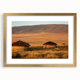 Extra large abstract art print depicting a textured African landscape in muted earth tones, framed in gold.