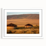 Abstract art print of a Tanzanian landscape in muted earth tones on a framed canvas, suitable for dining room decor.