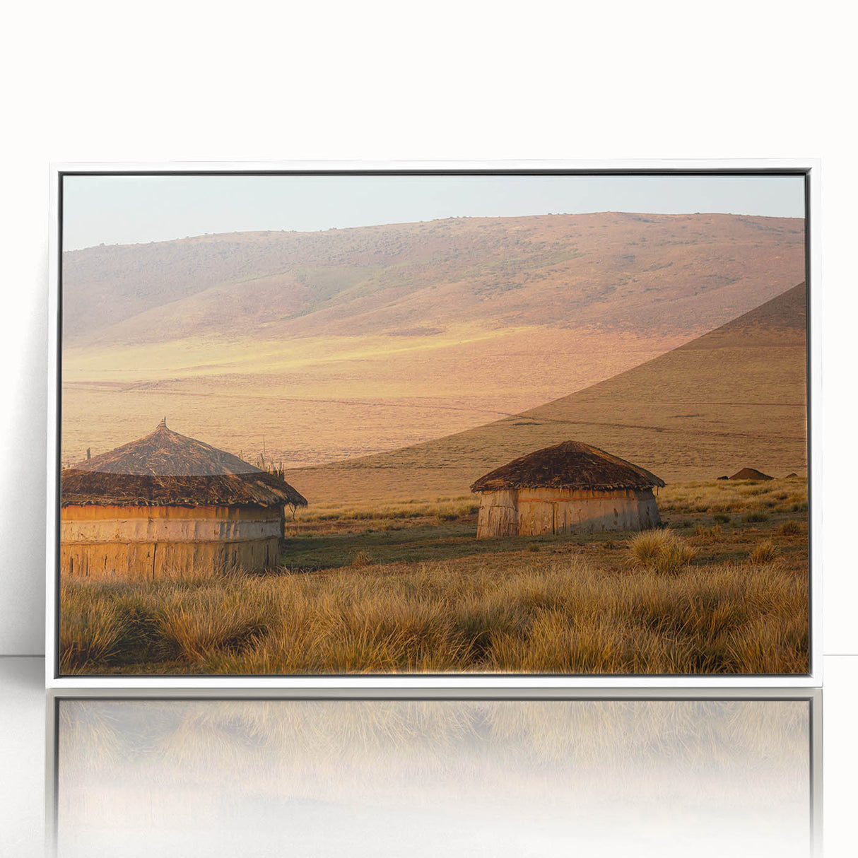 Acrylic print of Tanzanian scenery in muted earth tones, framed in white, suitable as modern art wall decor for a nursery.