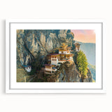 Abstract art print of Bhutan scenery in muted earth tones on a framed white mat, suitable for dining room decor.