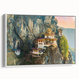 Vintage poster art of Bhutan scenery on framed canvas, featuring colorful art with black accents.