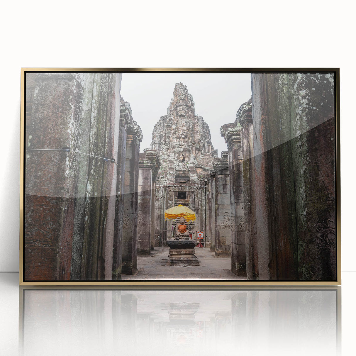 Large art print of a Cambodian landscape in muted earth tones, framed in gold acrylic, suitable for modern art wall decor.