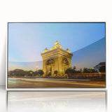 Art deco style poster of a Laos scenery in muted greens and blues, acrylic print framed in white.