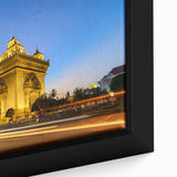 Extra large framed canvas featuring textured, colorful art of a Laos scenery in black with vivid accents.