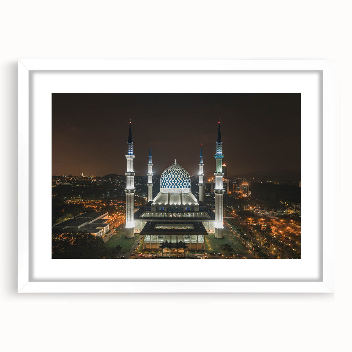Abstract art print of a Malaysian landscape in muted earth tones on a framed canvas.