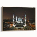 Framed canvas featuring a vintage-style landscape painting of a Malaysian scenery in black and gold tones.