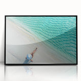 Large abstract wall art depicting a serene Maldivian landscape in muted blue tones, framed in black acrylic.