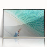 Mid-century modernist art of Maldivian scenery in muted blues and greens on a framed acrylic print.