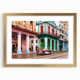 Abstract art print depicting a vibrant Caribbean scene in gold frame, ideal for dining room ambiance.