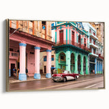 Framed canvas featuring a vintage-style Cuban landscape with lush greenery and a classic car, in gold and black tones.