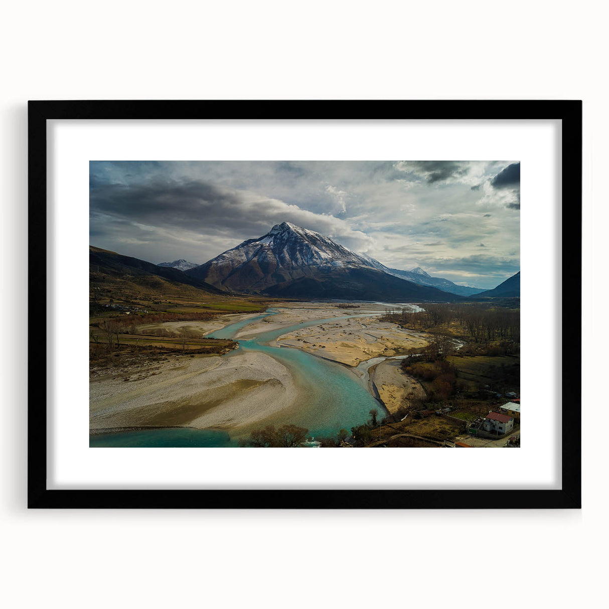 Colorful abstract art print of a textured European scenery, in a large black frame, ideal for living room decor.