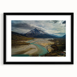 Colorful abstract art print of a textured European scenery, in a large black frame, ideal for living room decor.