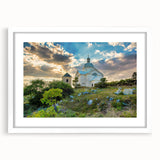 Textured art print of an abstract European scenery in muted earth tones, framed in white, ideal for bedroom decor.