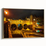 Framed canvas depicting a vintage-style landscape of Bath, England, in muted gold and black tones.