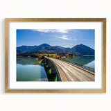 Abstract art print depicting a Bavarian landscape in muted earth tones, framed in gold, ideal for dining room decor.