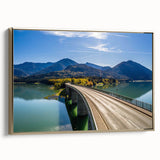 Framed canvas wall art featuring a vintage-style landscape of Bavarian scenery in muted gold and black tones.