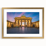 Abstract art print of Berlin skyline in muted gray and gold tones, framed with a gold mat, suitable for dining room decor.