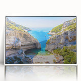 Mid-century modernist art depicting the scenic Capri coastline in muted blue and white tones on a framed acrylic print.