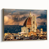 Framed canvas wall art featuring a vintage-style landscape painting of Florence, Italy, in muted gold and black tones.