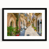 Extra large, textured abstract art print of colorful Sicilian landscape on a framed black mat, ideal for living room decor.