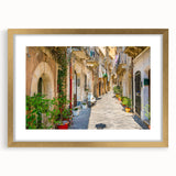 Abstract art print depicting a Sicilian landscape in muted earth tones on a framed canvas, suitable for dining room decor.