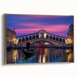 Framed canvas wall art featuring a vintage poster-style landscape of Venice, Italy in muted gold and black tones.