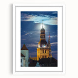 Textured abstract art print depicting a European landscape in muted earth tones, framed with a white mat.