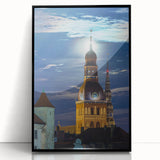 Large abstract wall art featuring a stylized European landscape in muted earth tones, framed in black acrylic.