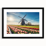 Colorful abstract art print of a European scenery in vibrant hues on a large textured canvas, framed in black.