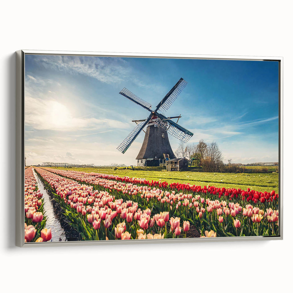 Framed canvas of a vintage-style landscape painting featuring colorful Dutch scenery, ideal for living room decor.