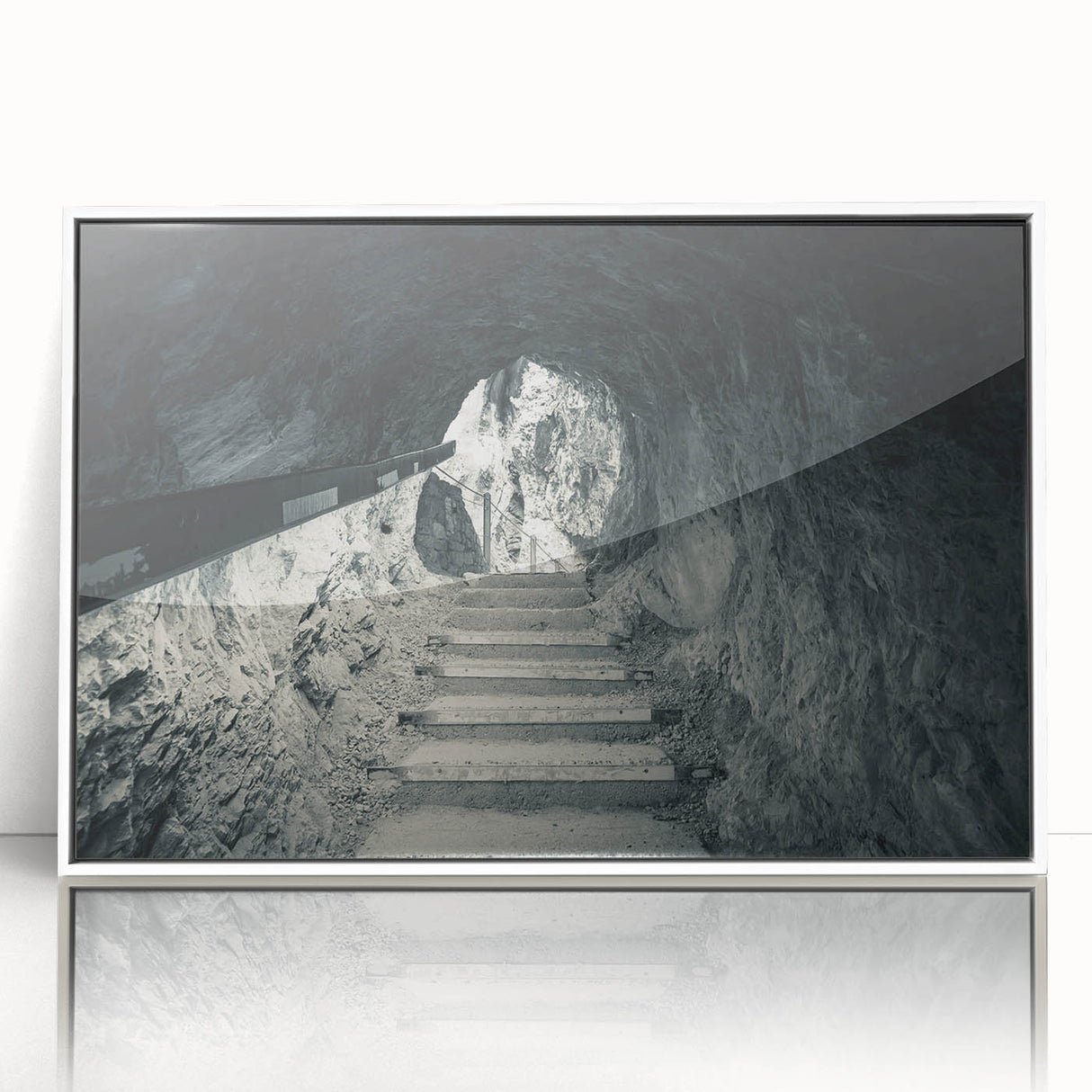 Large art print of a Slovenian landscape in muted green and blue tones, framed in white acrylic.
