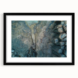 Extra large abstract art print of colorful, textured scenery resembling the Canary Islands, in a black frame with mat.