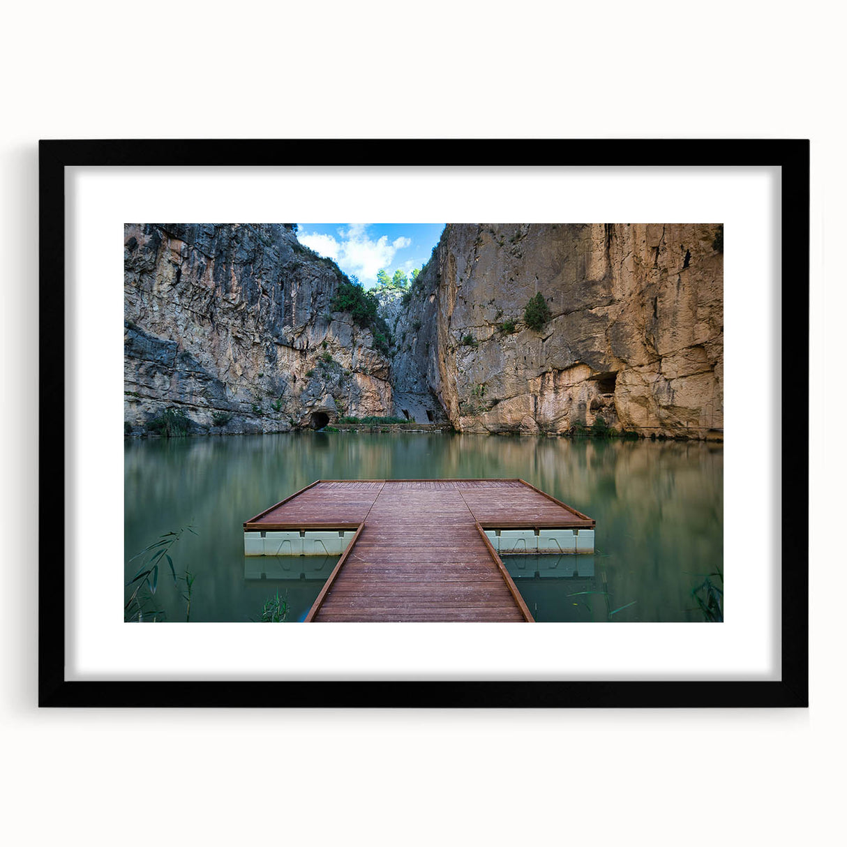 Colorful abstract art print of a textured European scenery in a black frame, ideal for living room decor.