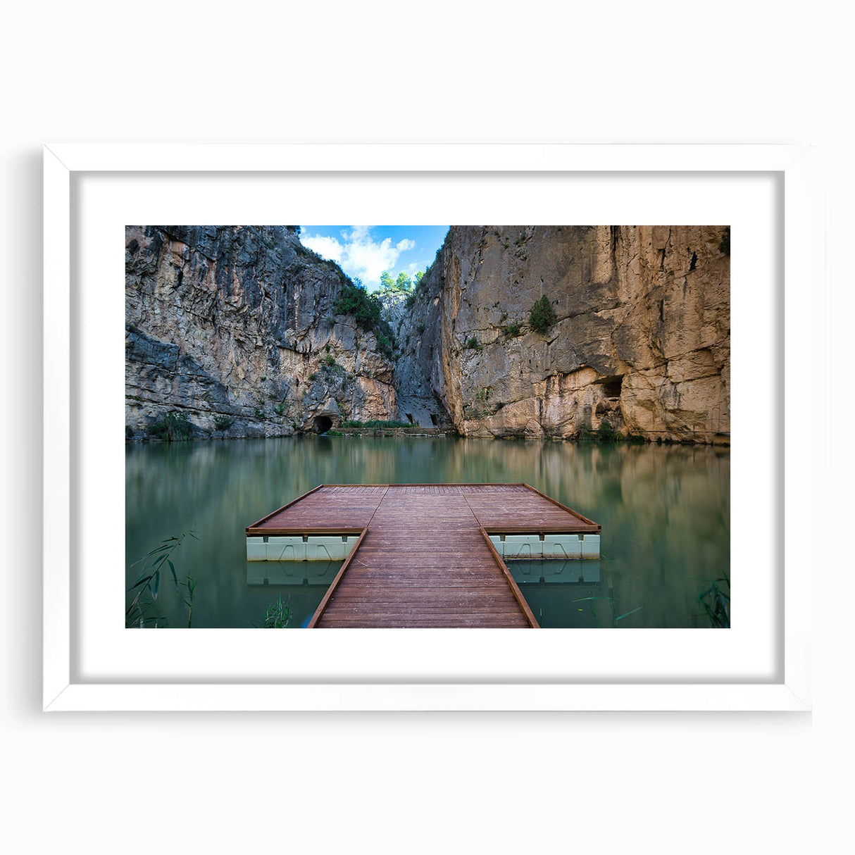 Abstract art print of Valencia scenery in muted earth tones on a framed white mat, suitable for dining room decor.