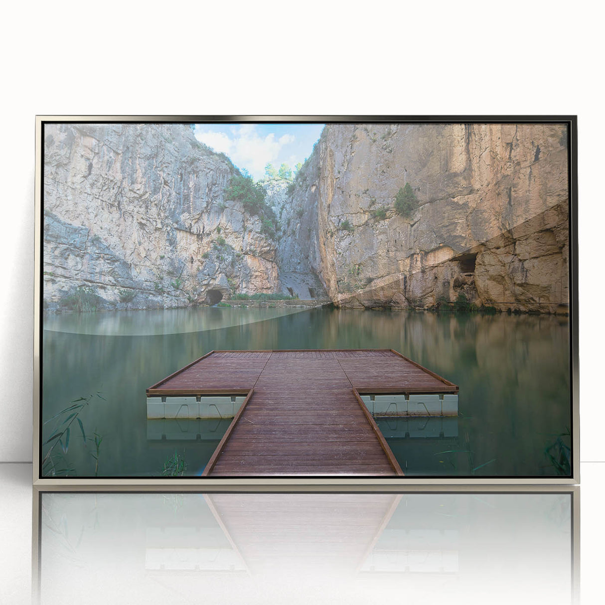 Mid-century modernist art depicting the Valencia skyline in muted earth tones on a silver-framed acrylic print.