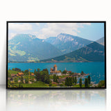 Large abstract wall art depicting a stylized Geneva landscape in muted gray and blue tones on black framed acrylic.