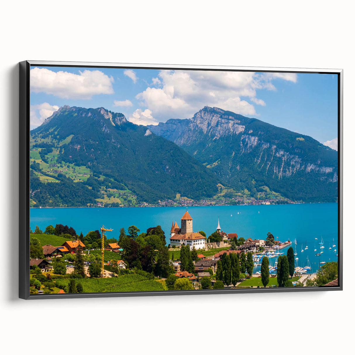 Black and white wall art featuring a vintage poster art style landscape of Geneva, Switzerland, on a framed canvas.