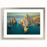 Textured abstract art print depicting Baja California scenery in earthy tones, framed in silver, suitable for bedroom decor.