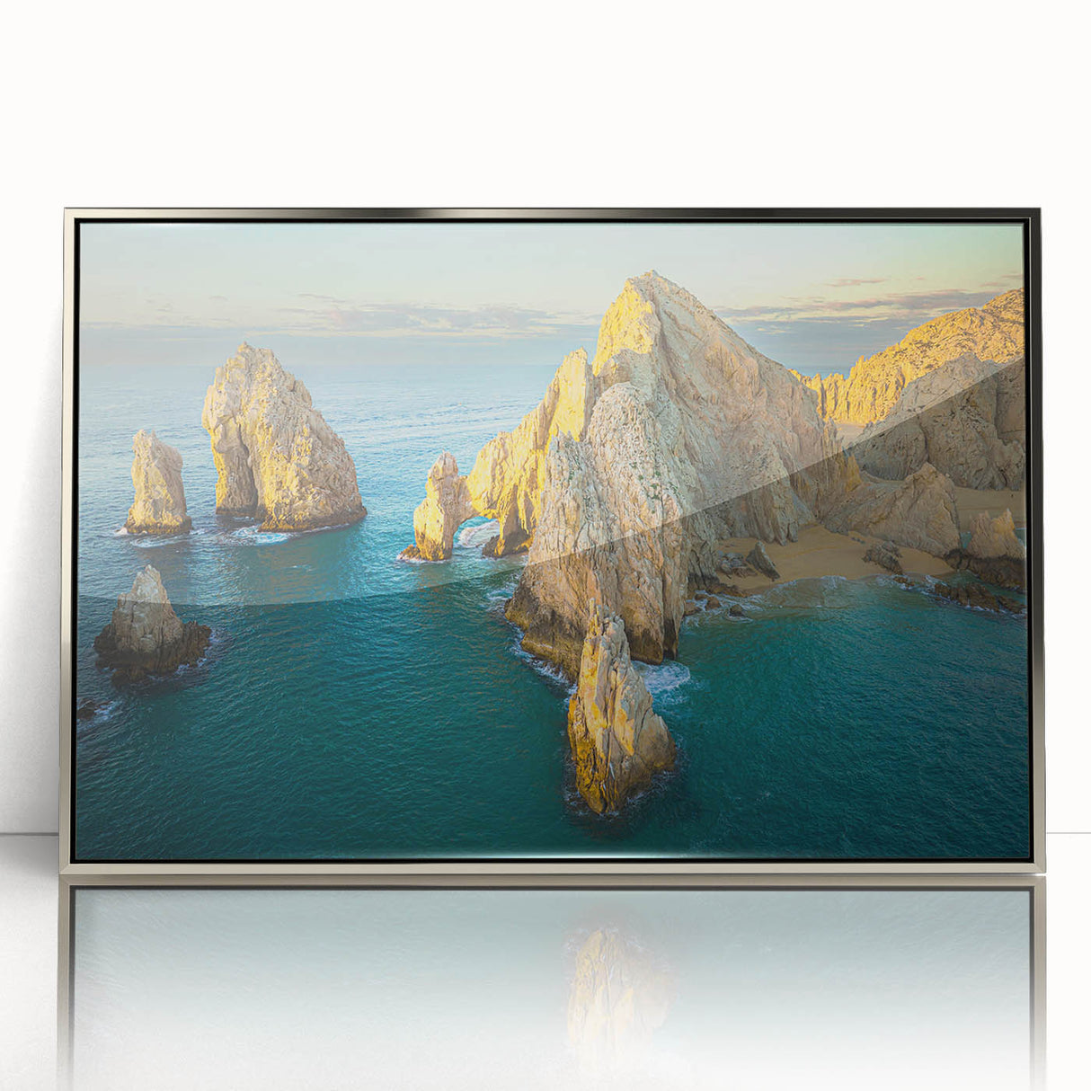 Mid-century modernist art depicting Baja California scenery in muted earth tones on a silver-framed acrylic print.