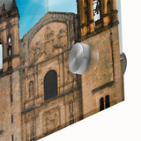 Large abstract wall art featuring a mid-century modernist scene of Oaxaca, Mexico, in muted earth tones on acrylic glass.