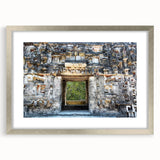 Textured abstract art print of a Yucatan scenery in a silver frame, featuring earthy tones, suitable for bedroom decor.