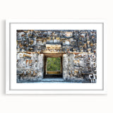 Abstract art print of Yucatan scenery in muted earth tones on a white framed mat, suitable for dining room decor.