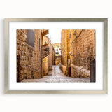 Textured art depicting an abstract Jerusalem cityscape in muted earth tones on a framed silver mat.